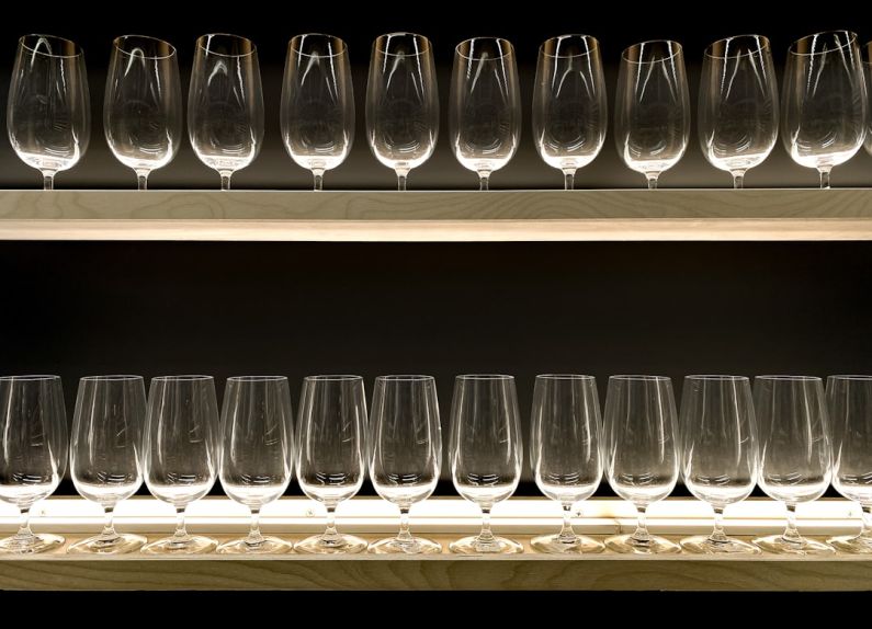 Beverage Cooler - clear drinking glasses on blue wooden shelf