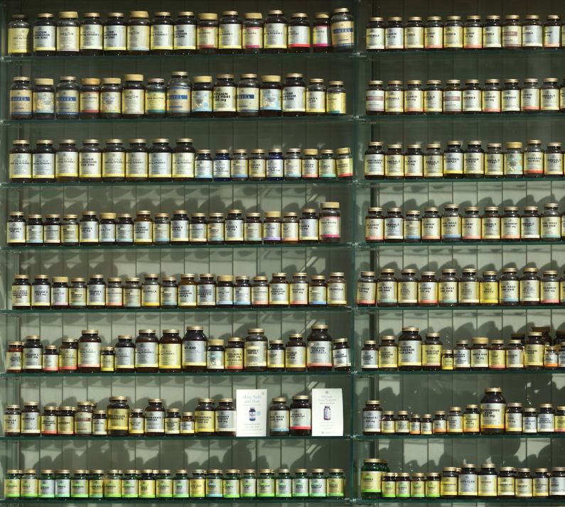 Supplements Shelf - assorted labeled bottle on display shelf