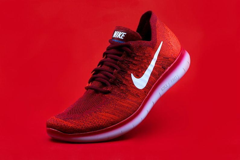 Specialty Shoes - unpaired red Nike sneaker