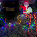 Seasonal Decor - a christmas display with a santa clause and candy canes
