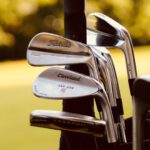Golf Clubs - gray steel golf clubs on selective focus photo