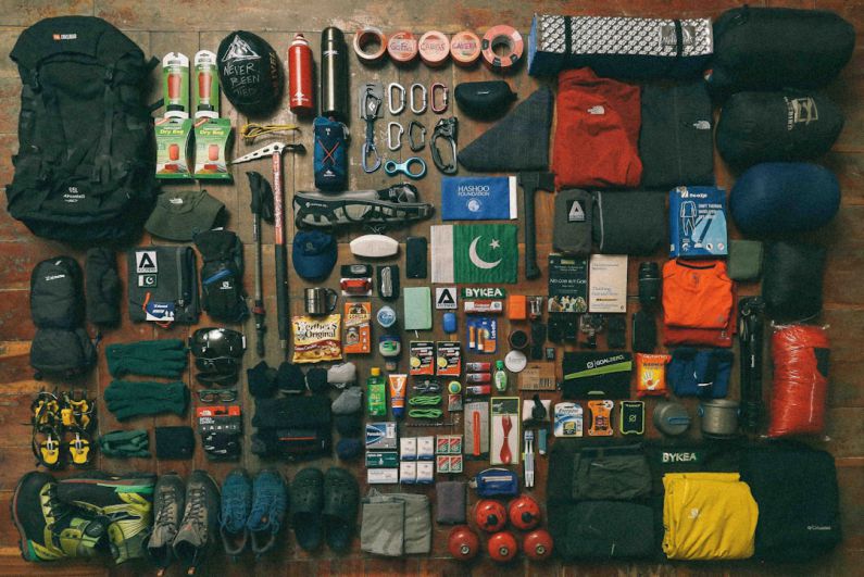 Camping Gear - assorted items on black textile