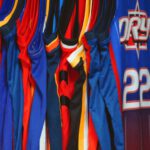 Sports Jerseys - a group of blue and red sports jerseys