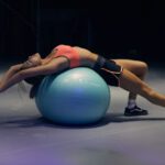 Exercise Ball - woman doing yoga on stability ball