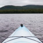 Kayaking Gear - point of view photography of kayak on lake