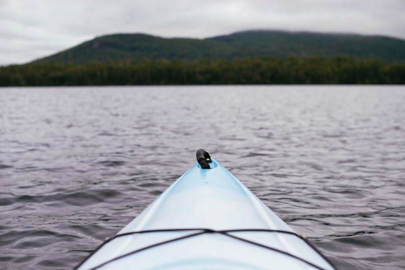 Kayaking Gear - point of view photography of kayak on lake
